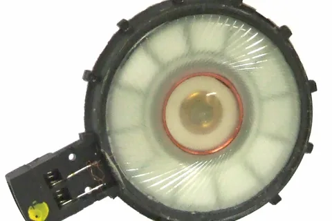The transducer (speaker) from a pair of mid-priced headphones
