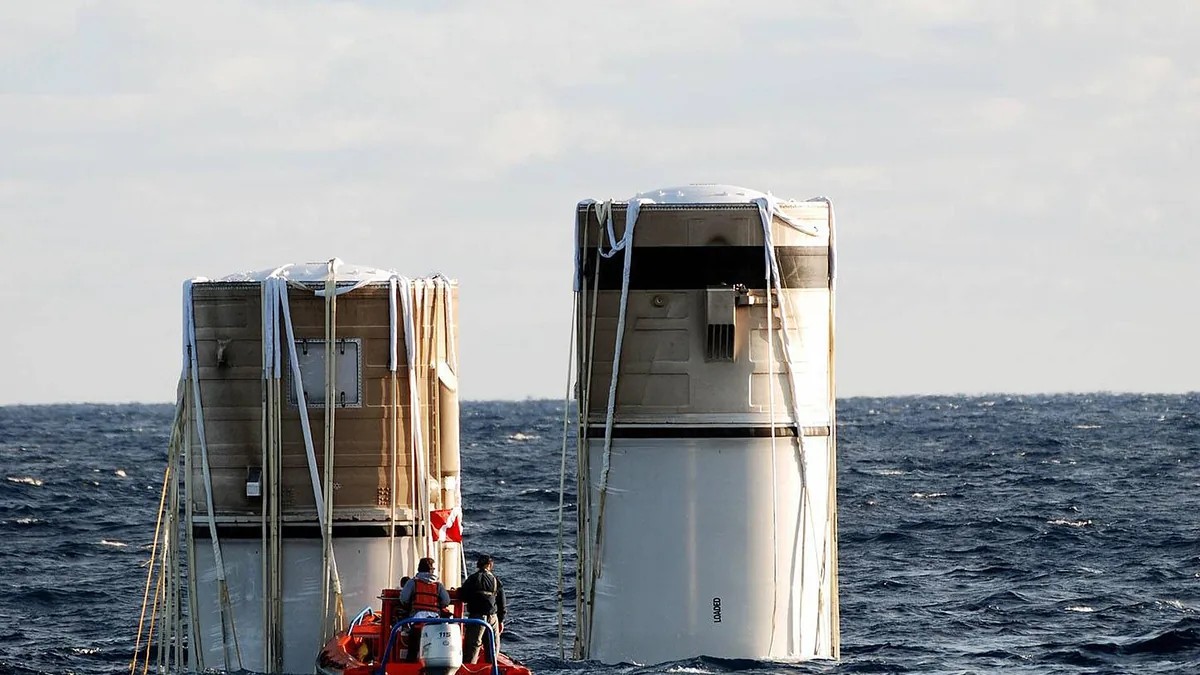 KENNEDY SPACE CENTER, FLA. -- Floating in the Atlantic Ocean about 150 miles north east of Cape Canaveral are the right and left solid rocket boosters, which were jettisoned from the Space Shuttle Discovery two and a hal