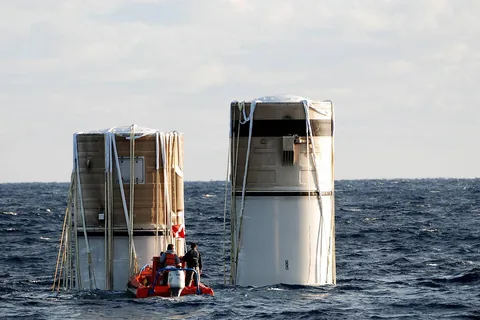 KENNEDY SPACE CENTER, FLA. -- Floating in the Atlantic Ocean about 150 miles north east of Cape Canaveral are the right and left solid rocket boosters, which were jettisoned from the Space Shuttle Discovery two and a hal