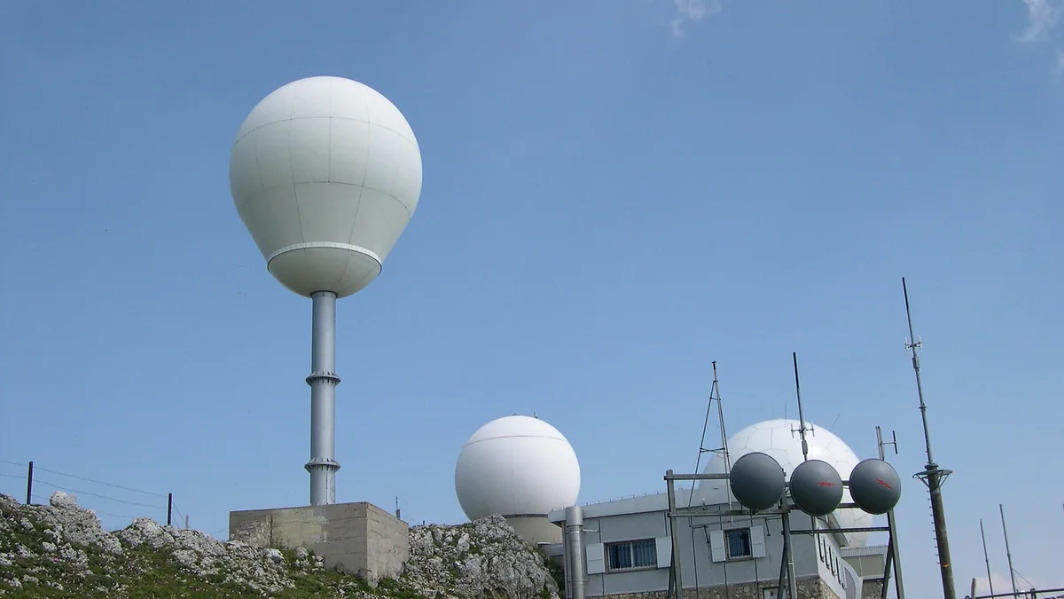 Photograph of radar and other electronic installations on La Dôle, Jura mountains, Switzerland. Vue sur les radars implantés au sommet de La Dôle, 1677 m, dans le Jura vaudois en Suisse. Applications: aviation civile et 